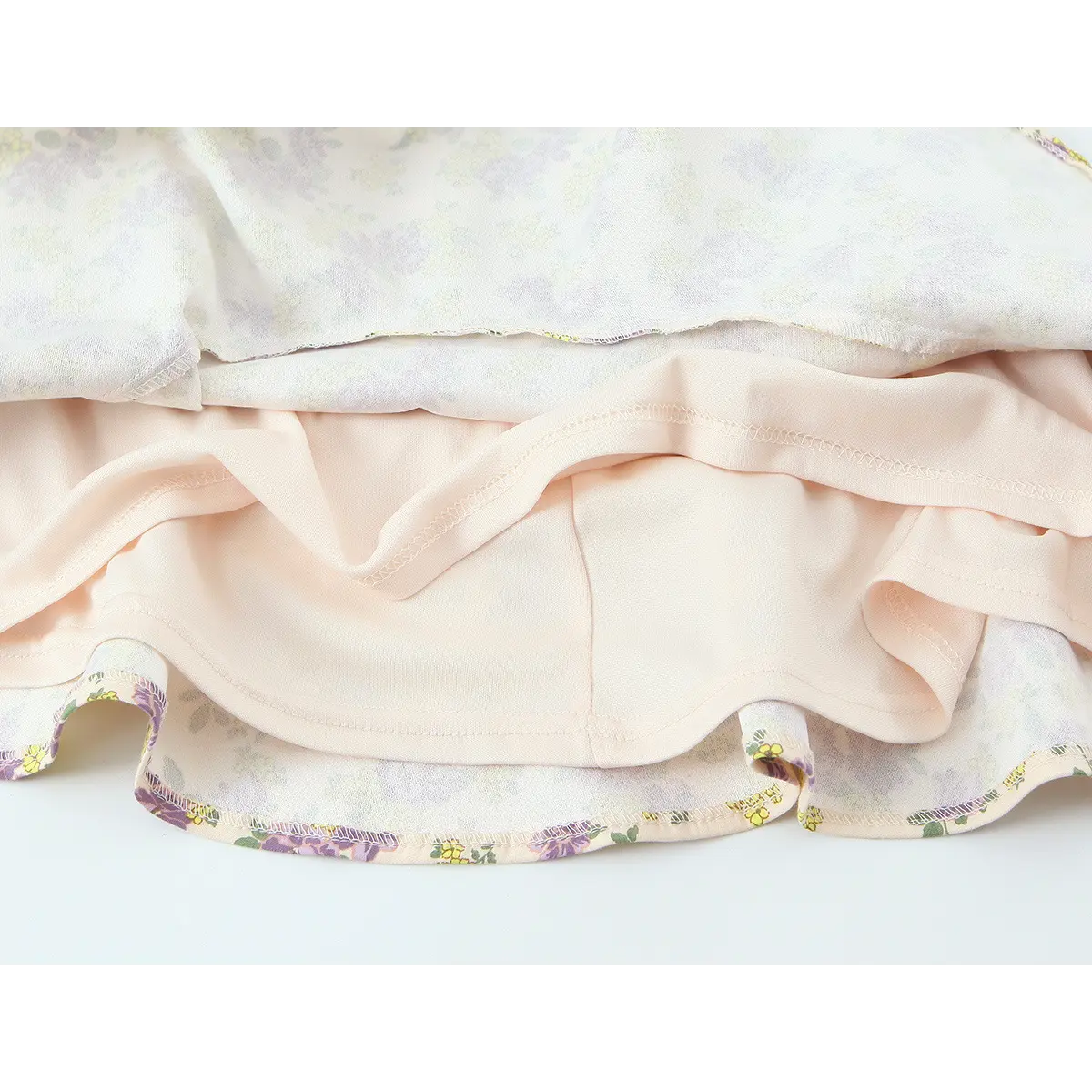 Lining view of the cream floral dress, showing the double-layered construction and inner fabric