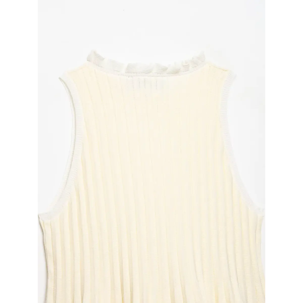 Back view of the cream ribbed knit top, showing the ruffled neckline and smooth vertical ribbing