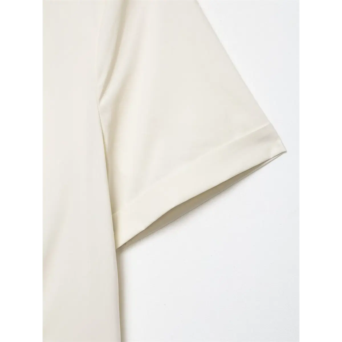 Close-up of the short sleeve, showing the finished cuff and fabric drape