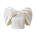 Front flat lay view of cream satin oversized big bow off shoulder cropped top