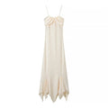 Front flat lay of cream satin ruched cami midi dress