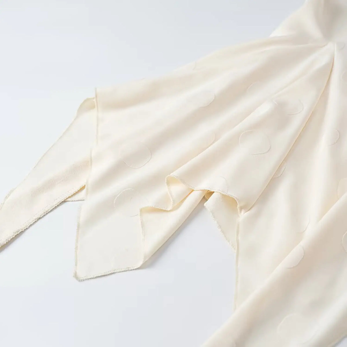 Close-up of asymmetric ruffle hem