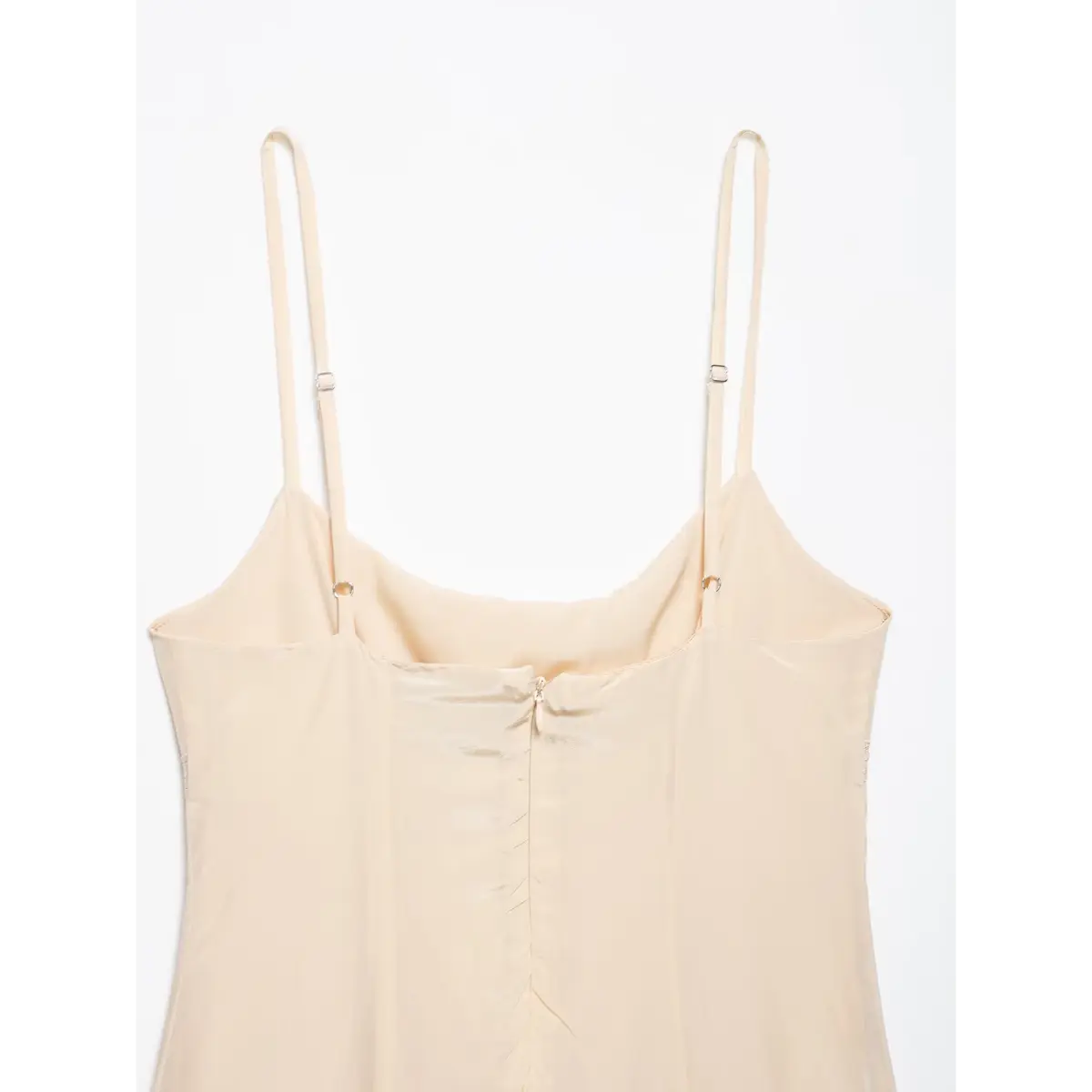  Back view of the dress, showing the center zipper, adjustable straps, and ruched back panel.
