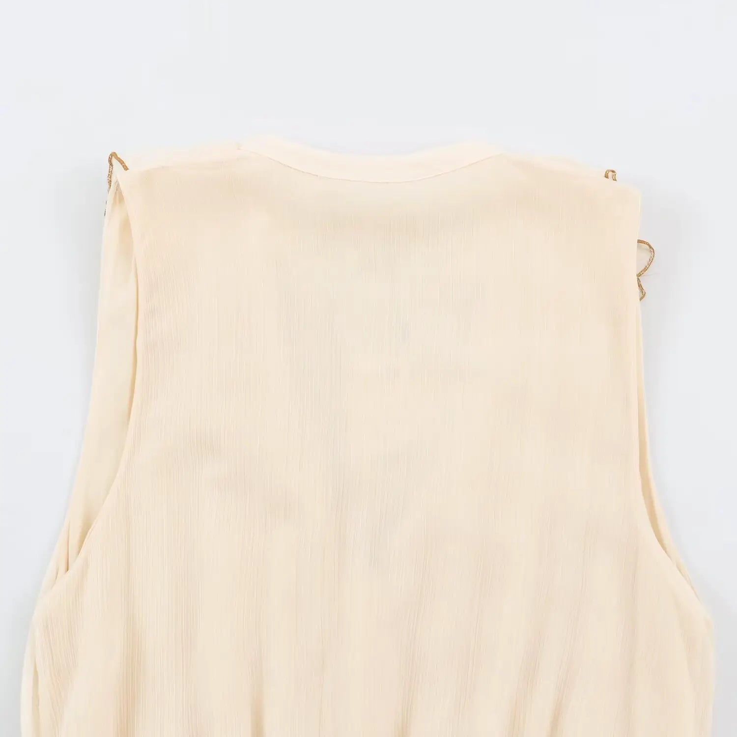 Upper back flat view cream sleeveless tiered maxi dress textured fabric