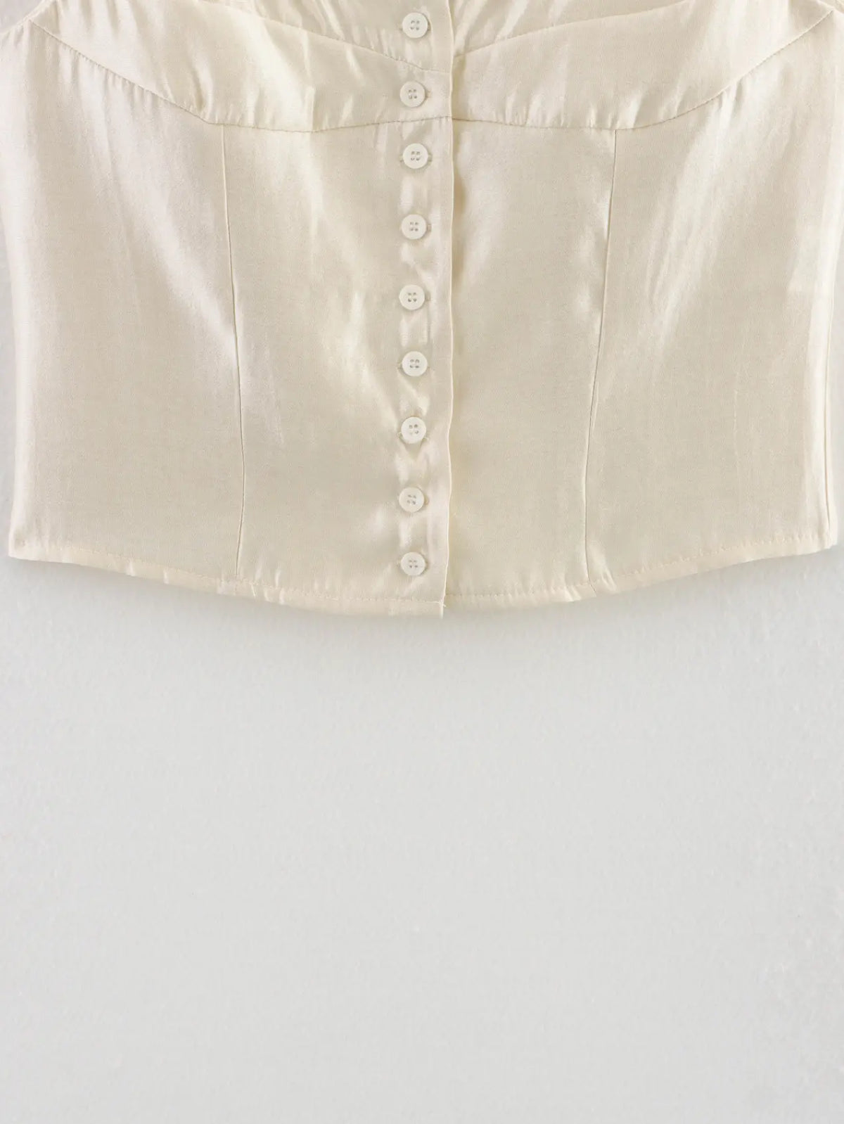 Close-up of button placket and bust seam