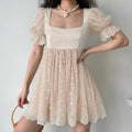 Cream square neck puff sleeve daisy embroidered tulle mini dress full body model shot, satin fitted waist A-line swing skirt, lace ruffle cuffs, matched with rattan handbag soft french date casual outfit display