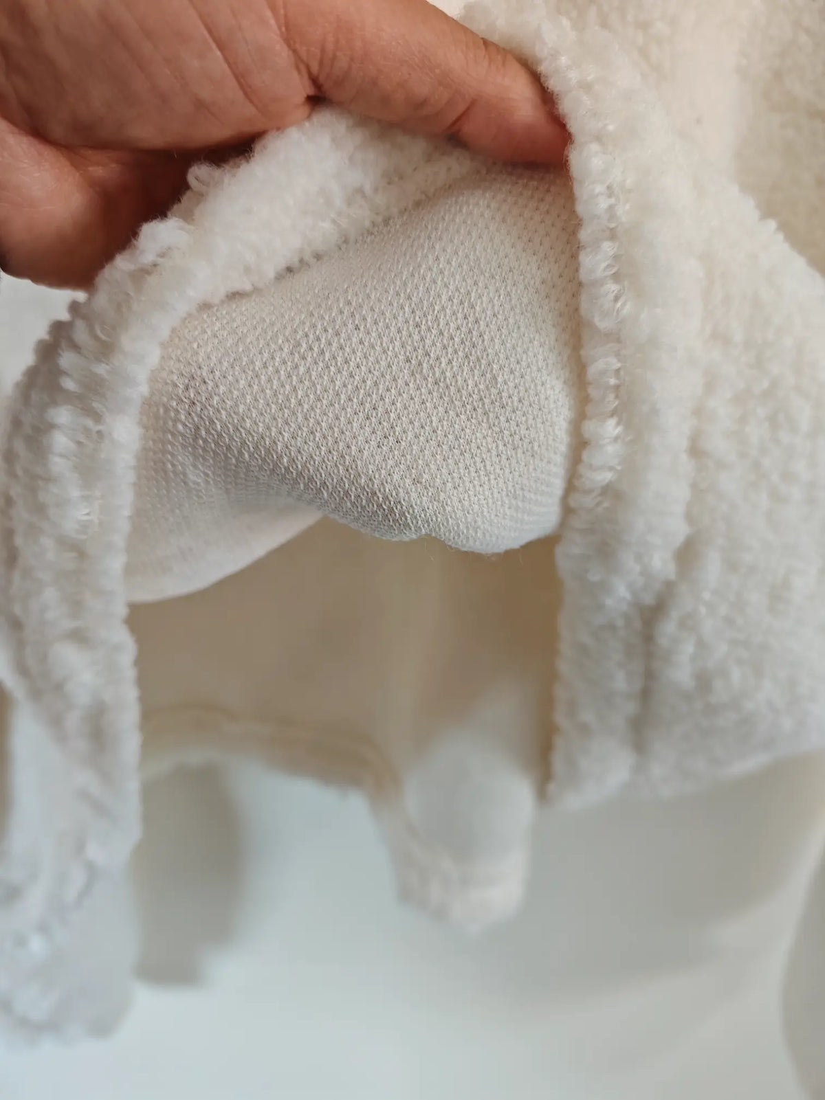 Close-up of inner knit lining and teddy fleece edge