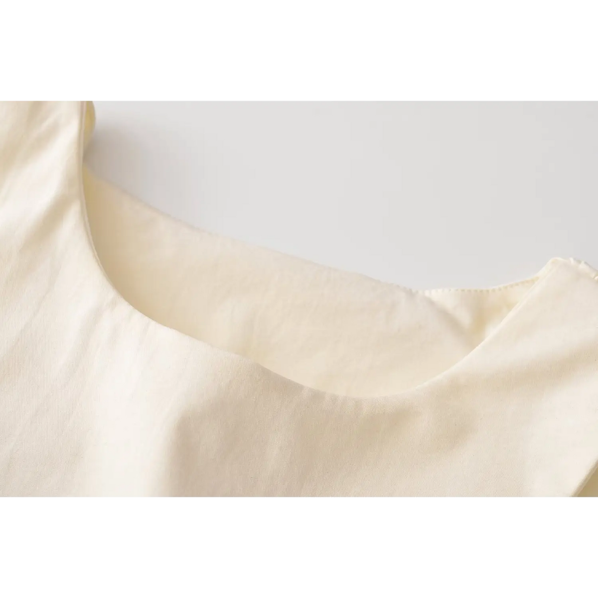 Close-up of round neckline binding