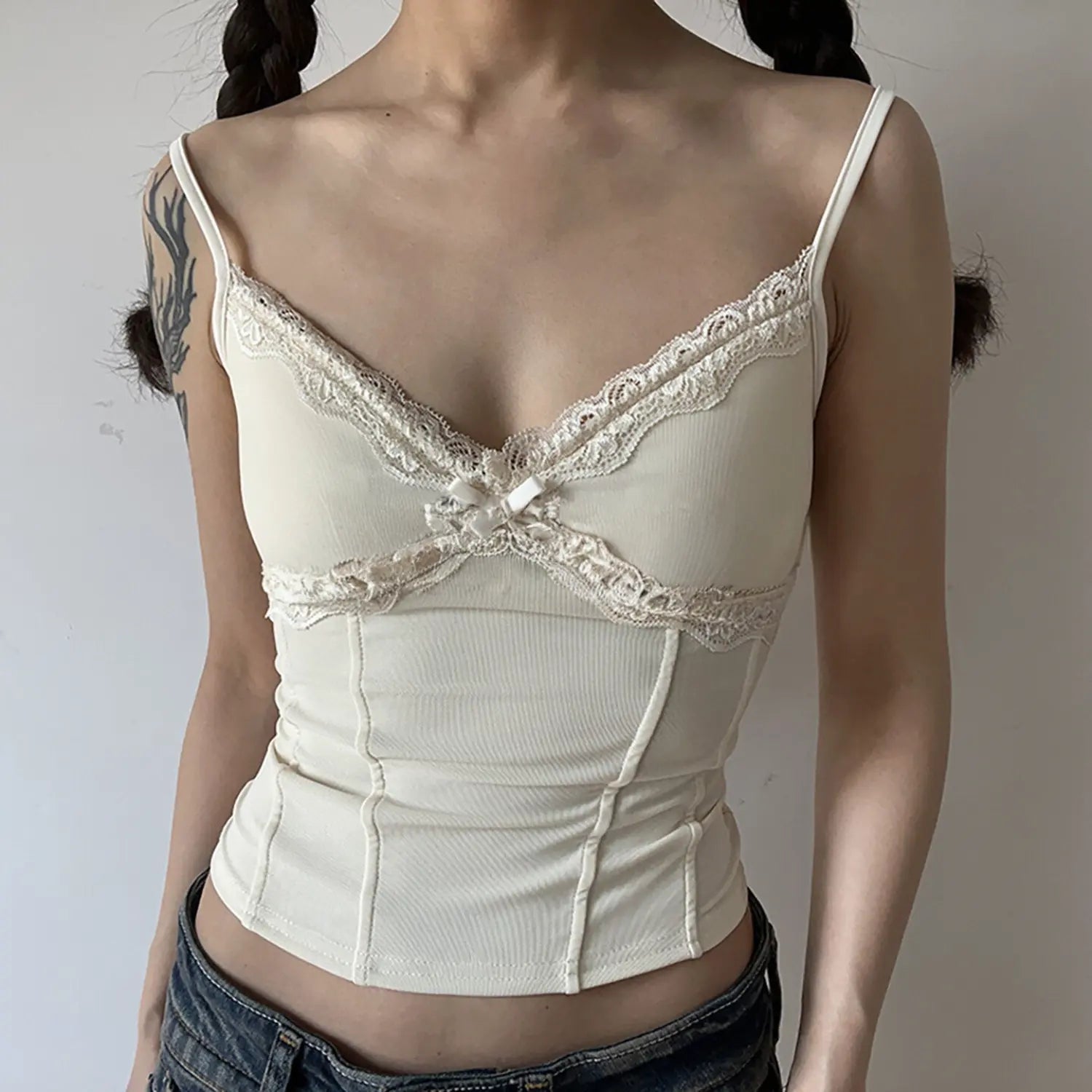 Off-white ivory camisole front lifestyle shot, cream lace decoration, soft milky tone, gentle daily casual styling