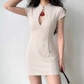 Model wearing cream white qipao front lifestyle shot, show real slim fit wearing effect, hollow neck decorative pendant