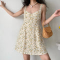 Cream base yellow & blue tiny floral wide strap smocked waist mini dress full body model shot, sweetheart V neck elastic ruched waist A-line short silhouette, matched with rattan handbag soft spring vacation casual street outfit display