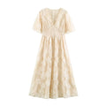 Front flat‑lay view of cream v‑neck maxi dress with 3d floral applique, polka dot tulle and short flutter sleeves