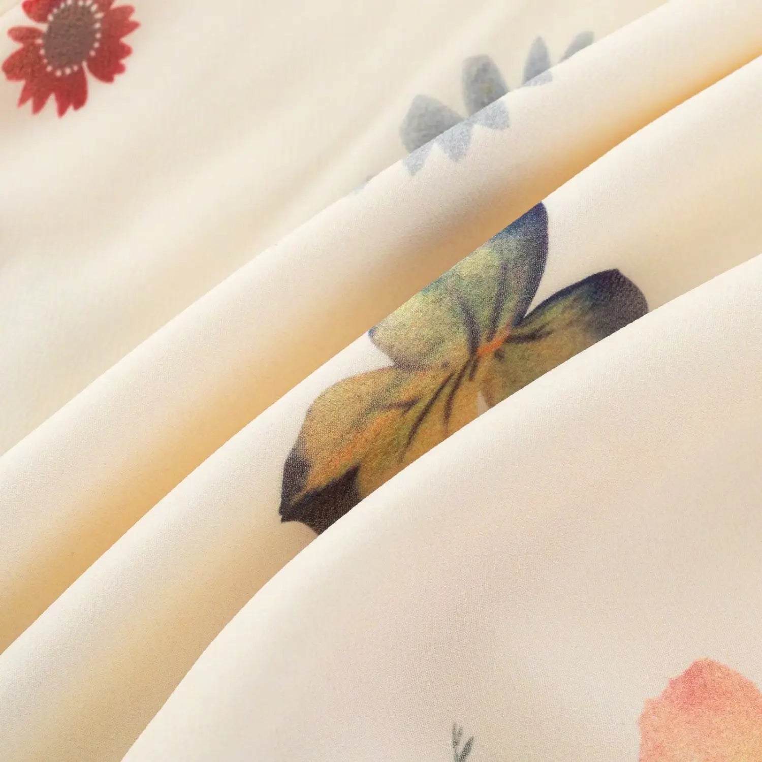 Macro close‑up of colorful mixed floral print chiffon fabric