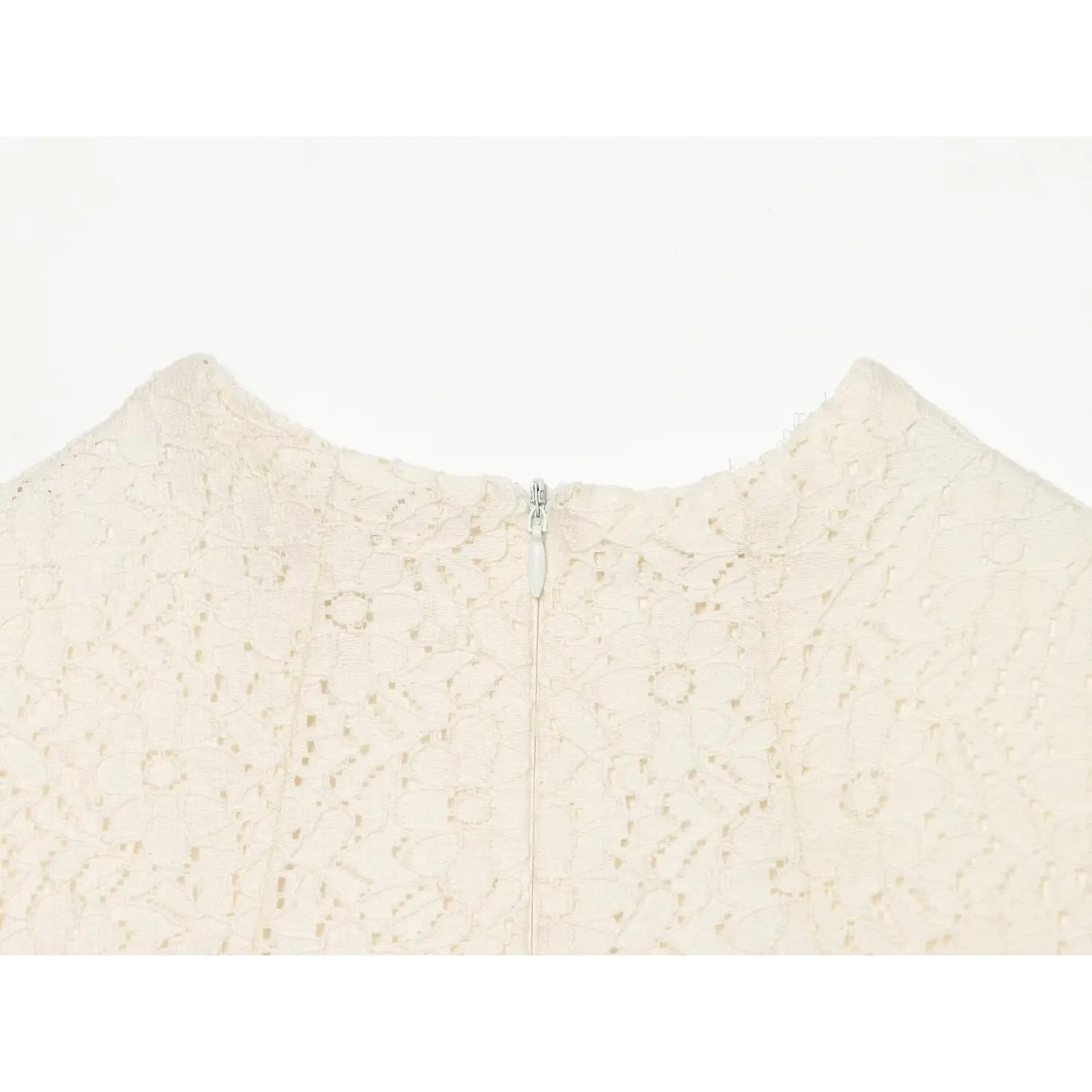 Close‑up of back neck invisible zipper on cream lace dress, stand collar and floral lace pattern