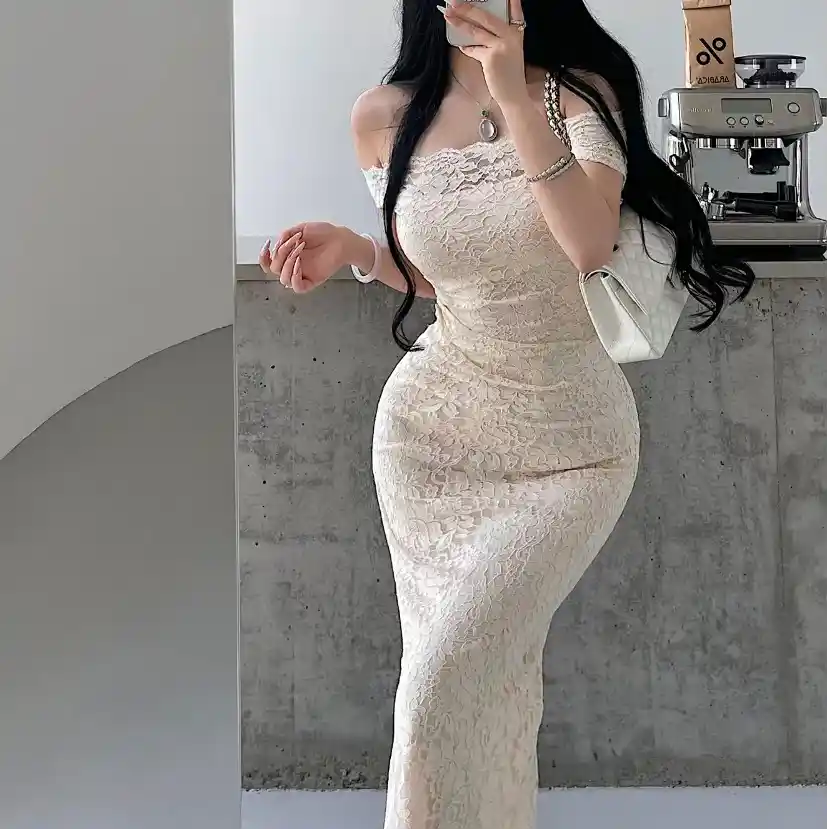 Side view model shot of cream off‑shoulder lace maxi dress