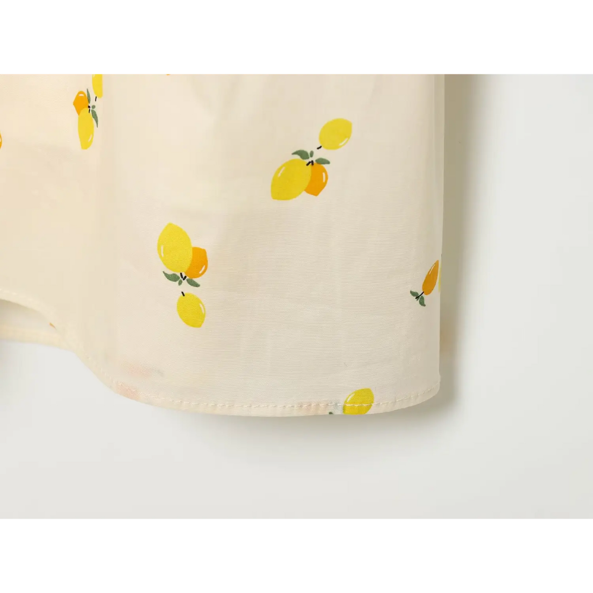 Close‑up of finished skirt hem with lemon fruit print
