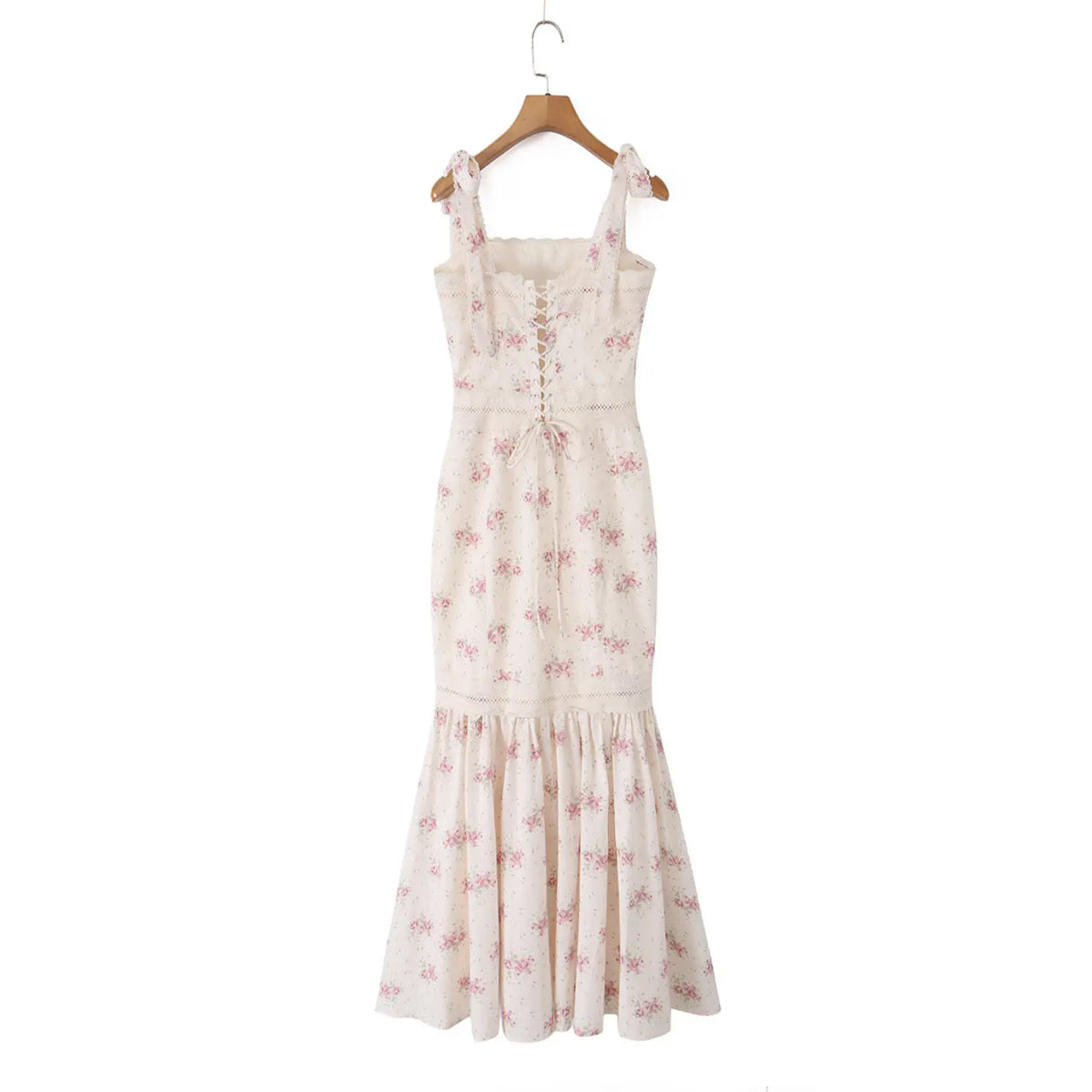 Cream pink floral mermaid maxi dress hanging on wooden hanger, back view
