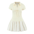 Cream waffle knit polo collar mini dress, short sleeve front tie knot bubble ruffle skirt, white background product shot