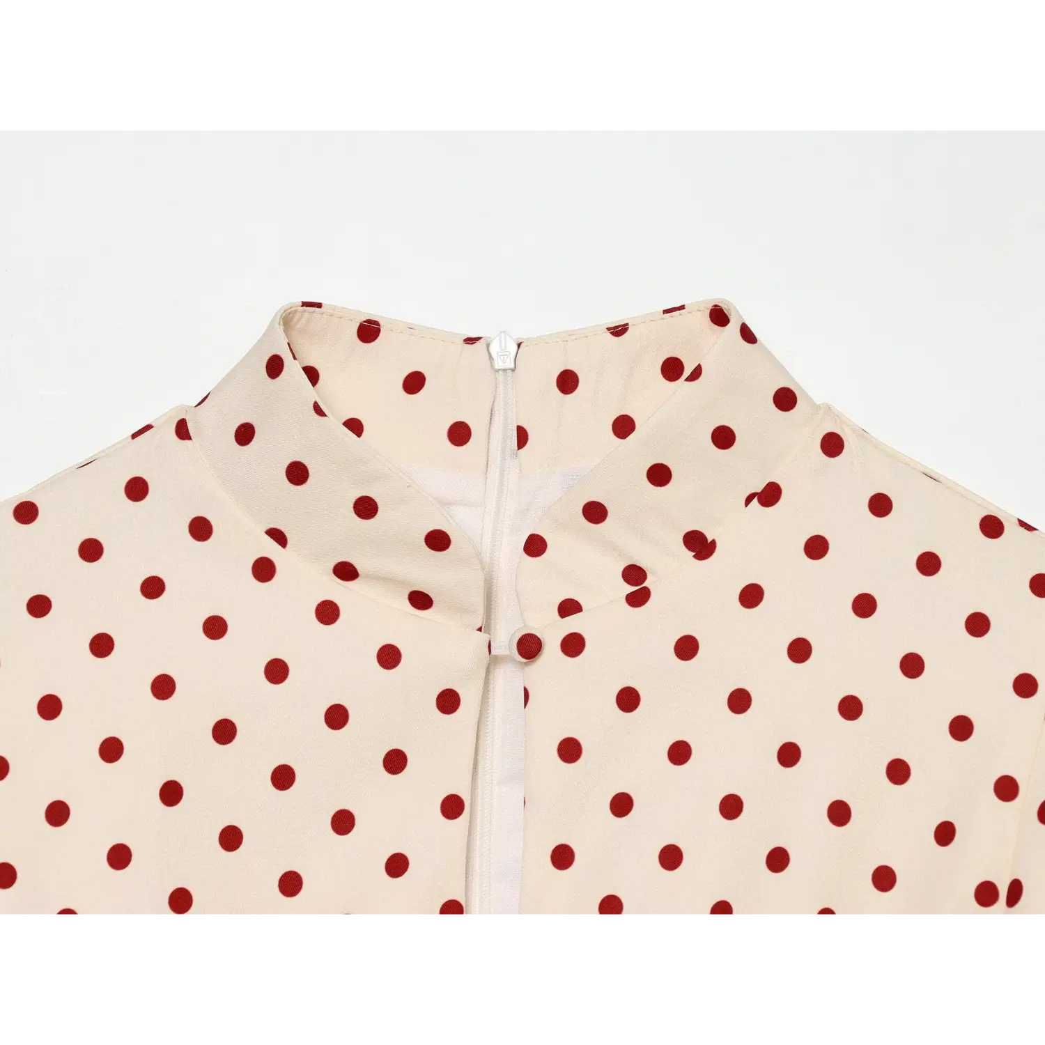 Cream red polka dot dress stand collar close‑up,concealed back zipper and fabric button detail