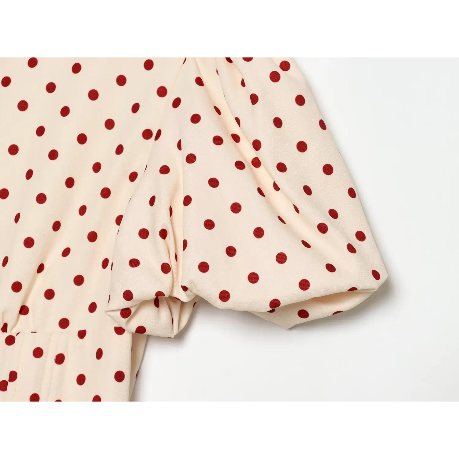 Cream red polka dot dress puff short sleeve close‑up,gathered bubble sleeve fabric detail
