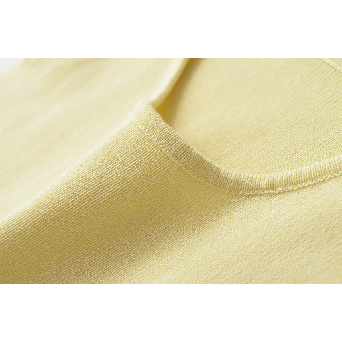 Macro close of crew neck rib binding & fine rib knit texture
