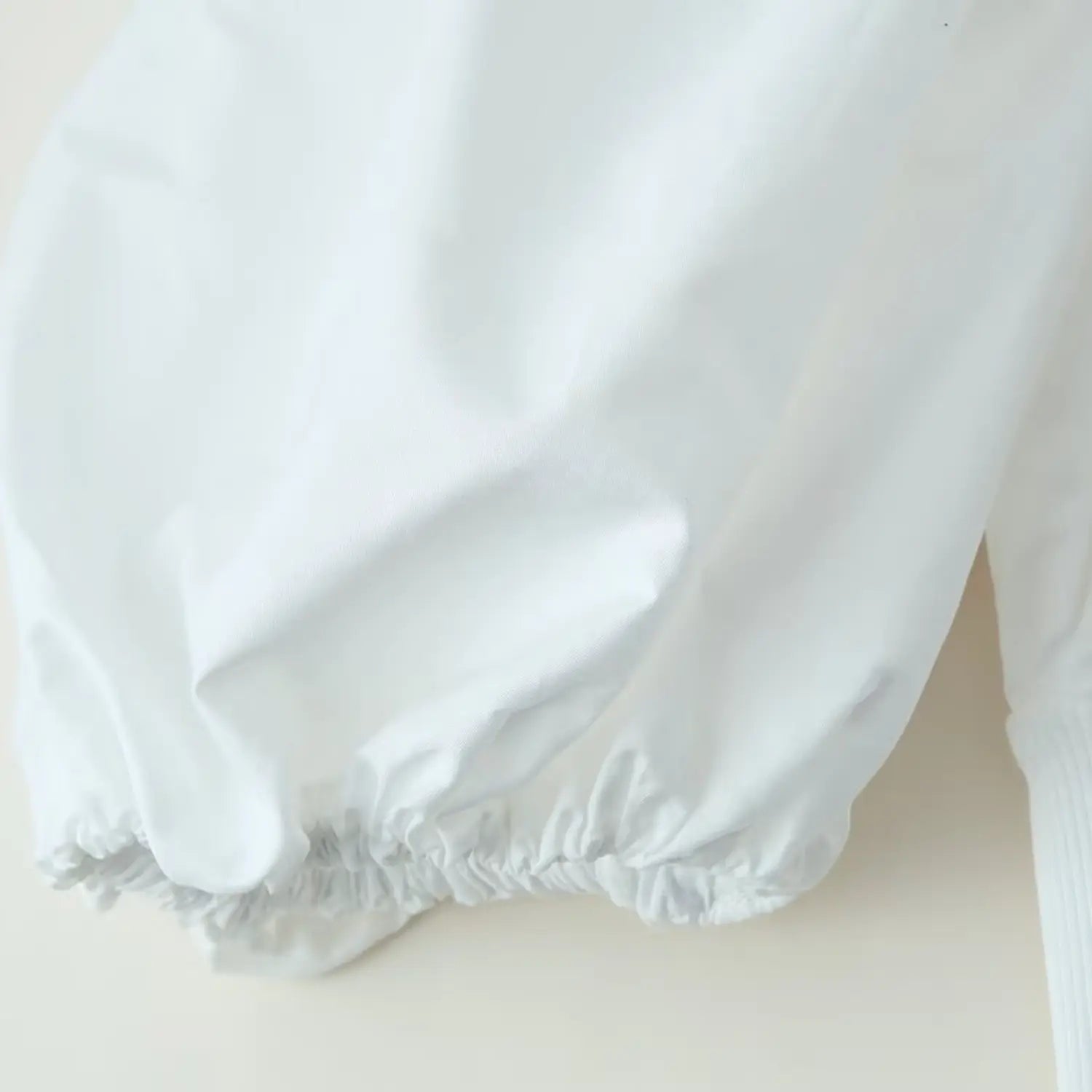 Drape shot of lightweight non-stretch woven fabric for sleeves & bust