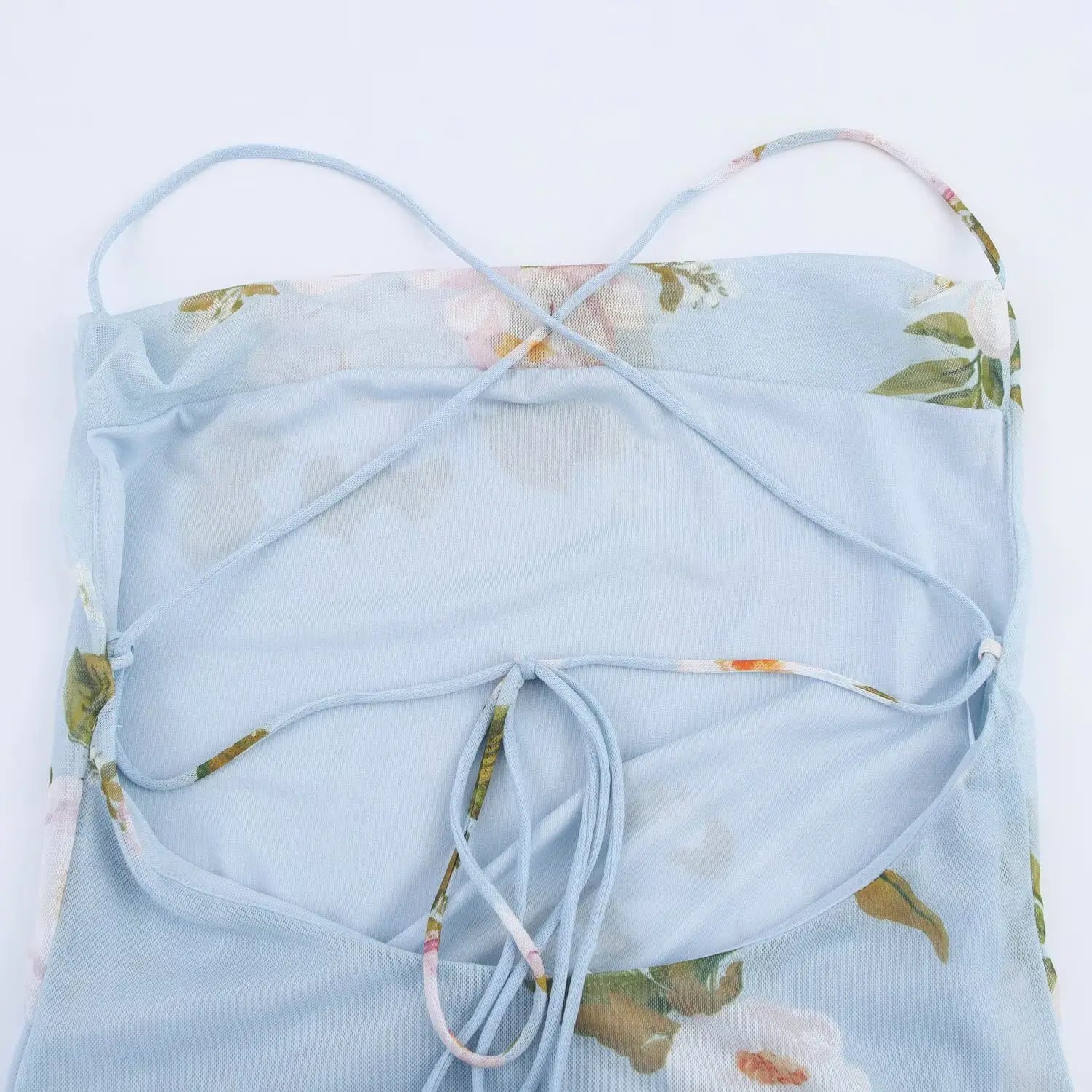 Close‑up of full criss‑cross tie‑up back bodice for light blue floral cowl neck slip mini dress