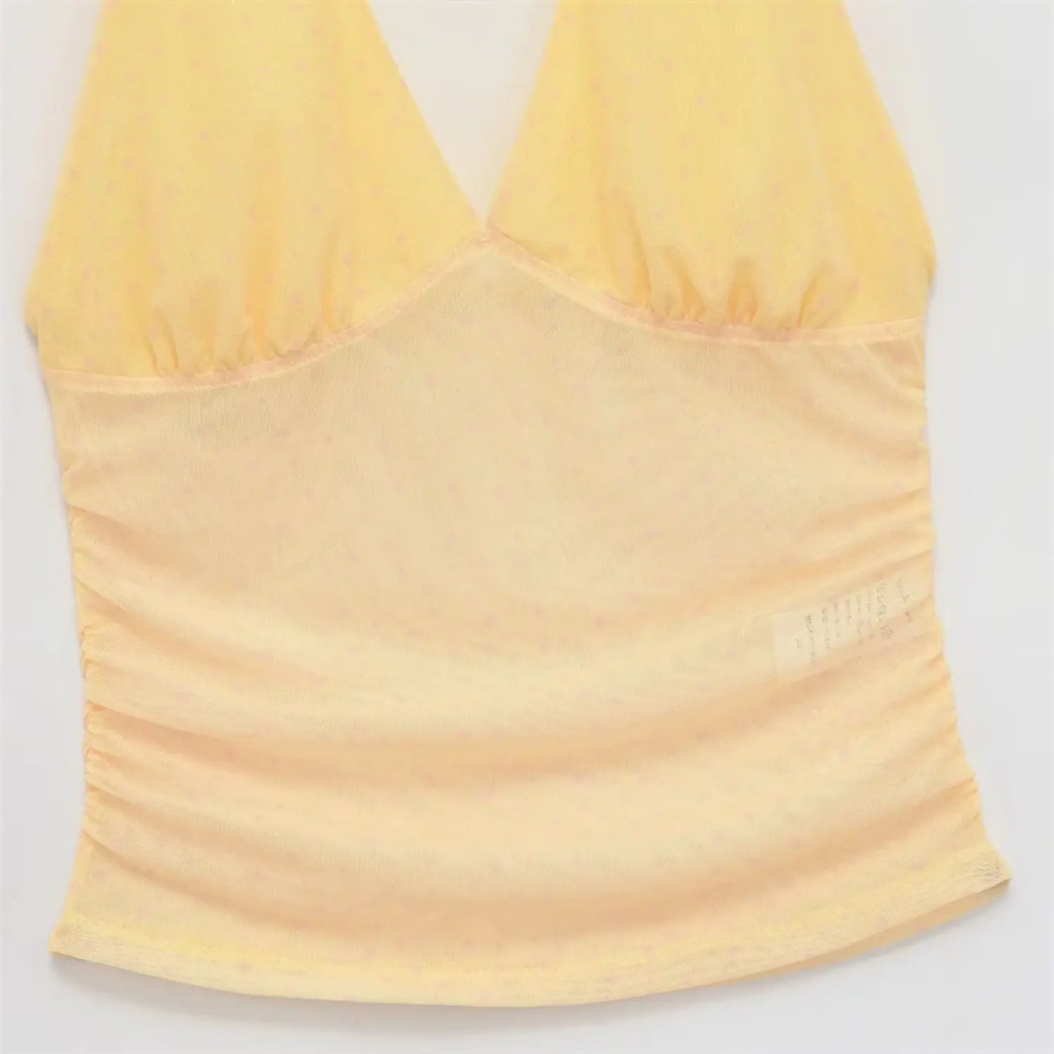 Cropped hem close-up, double layer sheer mesh and lining, narrow bottom binding, inner side label visible