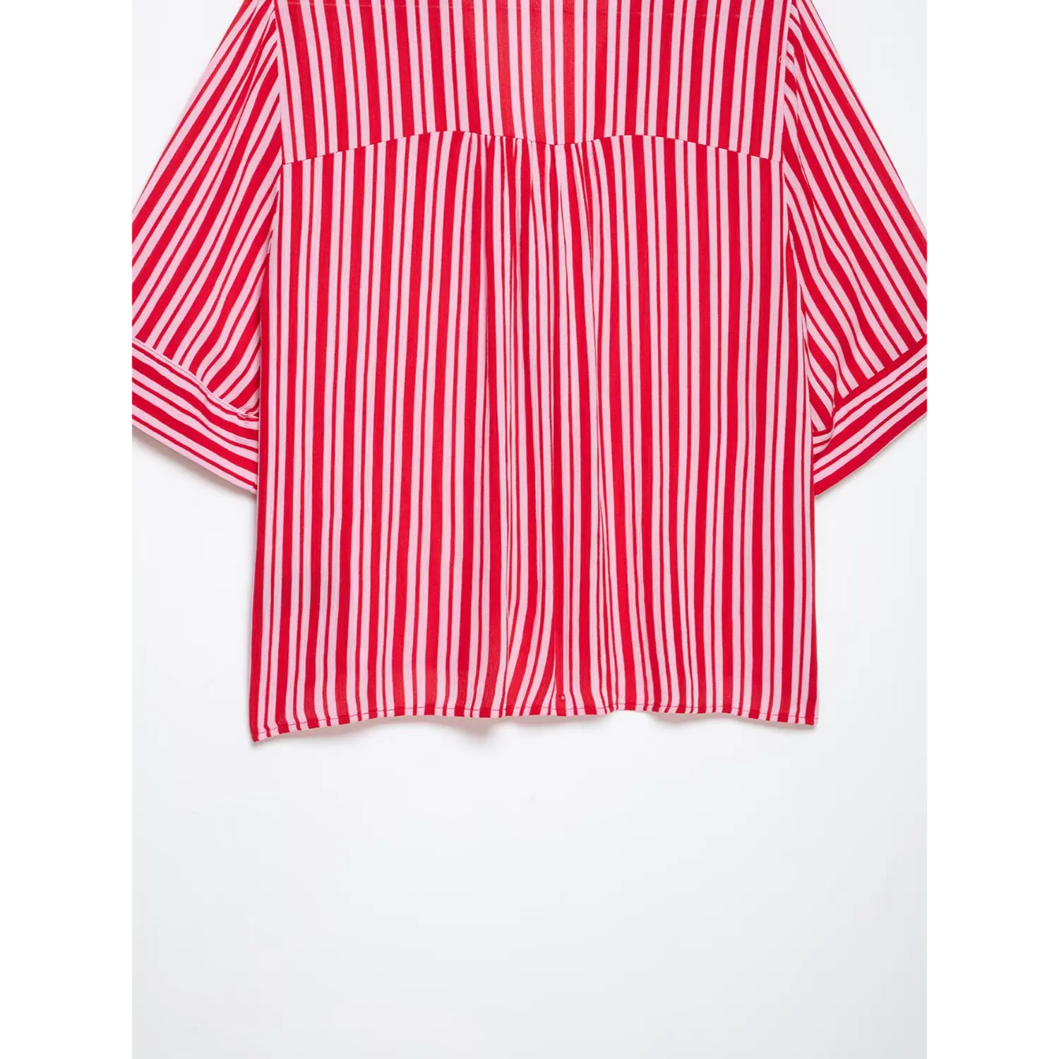 Full lower back shot, straight finished hem and lightweight crinkled stripe material