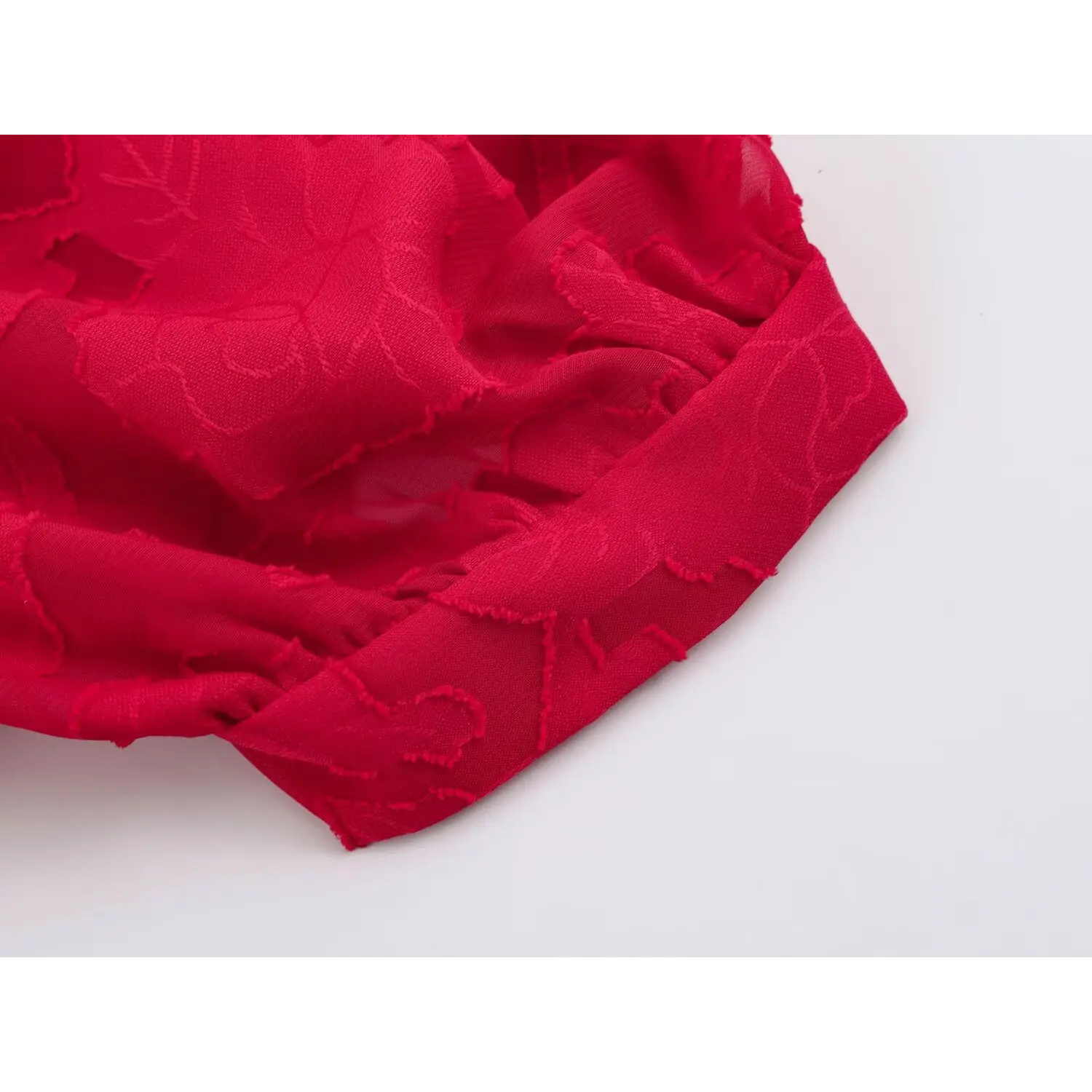 Crop top bottom elastic hem close-up, stretch gathered waist band, embossed red flower jacquard woven
