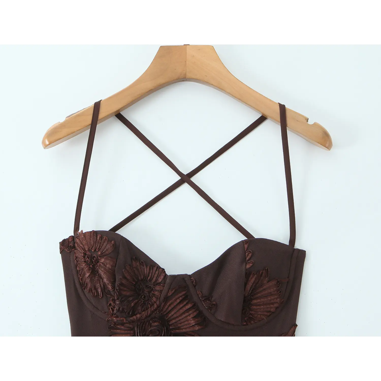 Cross thin spaghetti strap heart shaped fixed bust cup macro close-up, mesh binding seam 3D floral applique molded bra cup stitching detail shot