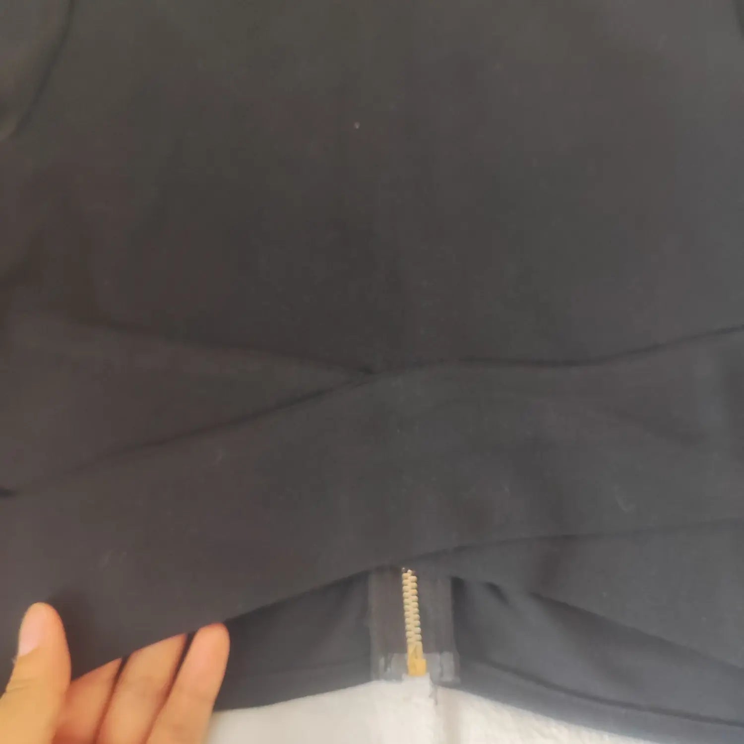 Close up detail of front wrap crossover band on black crop blouse