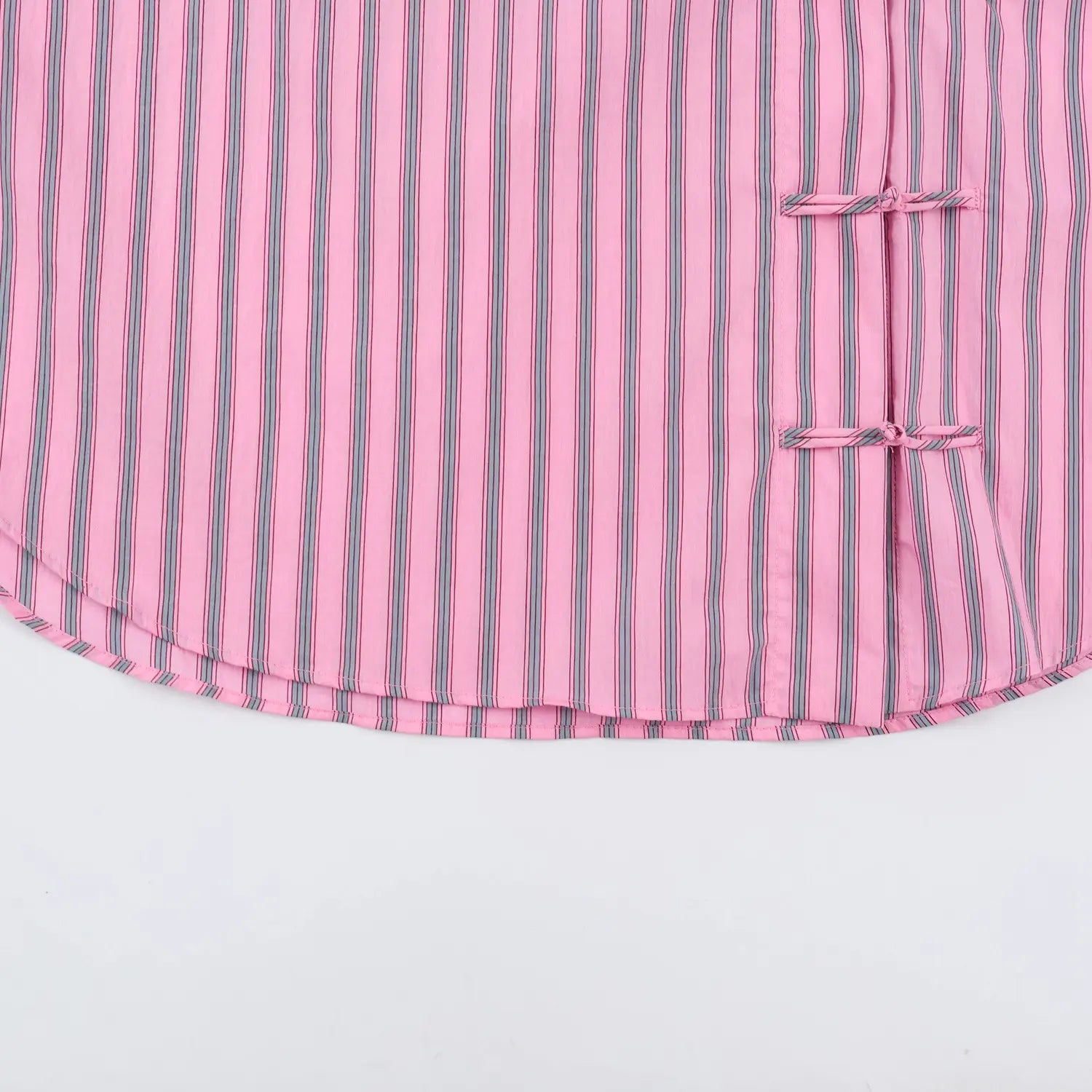 Full bottom view curved shirttail hem, relaxed oversized silhouette