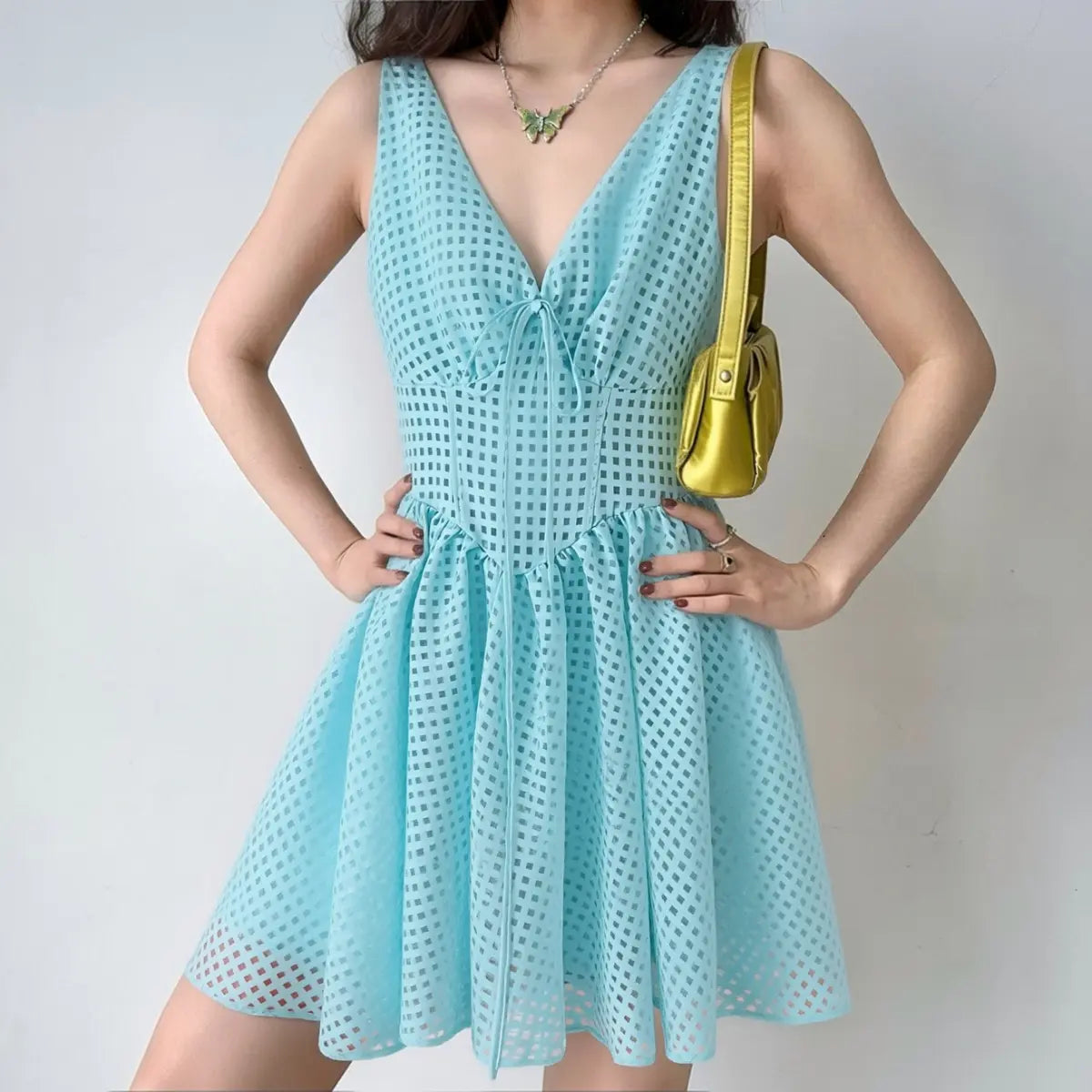  Lifestyle photo sky blue jacquard tie front mini dress with shoulder bag
