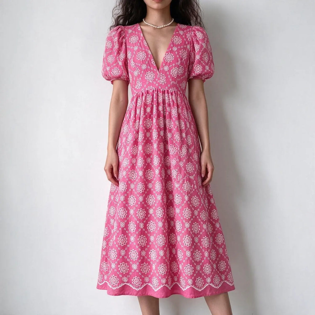 Model wearing daisy eyelet embroidery puff sleeve midi dress, front view