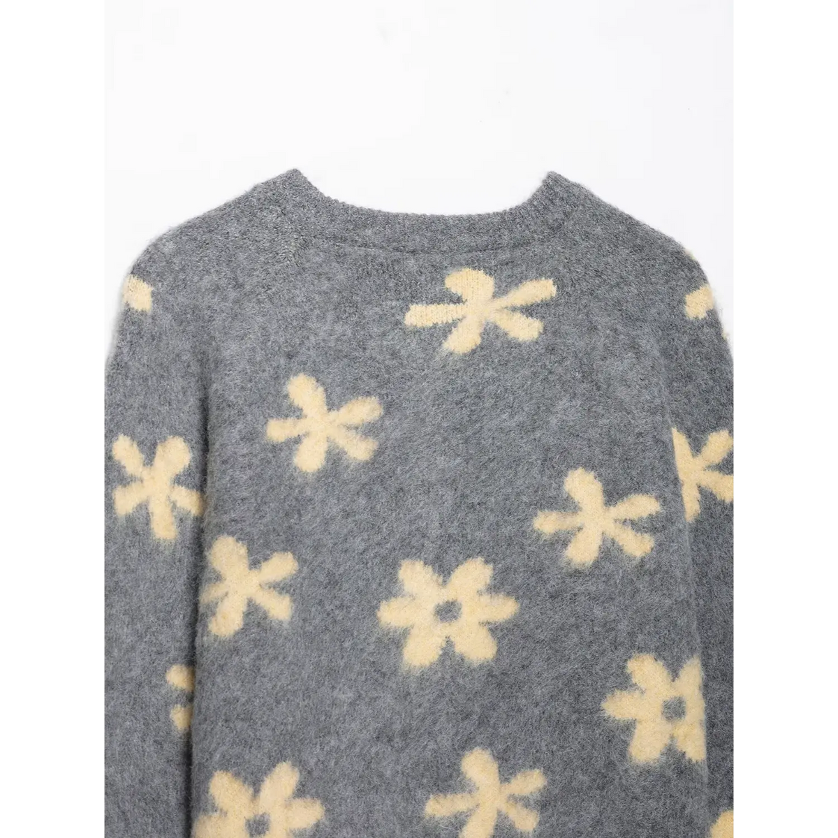 Close-up of back neckline and daisy pattern on yoke