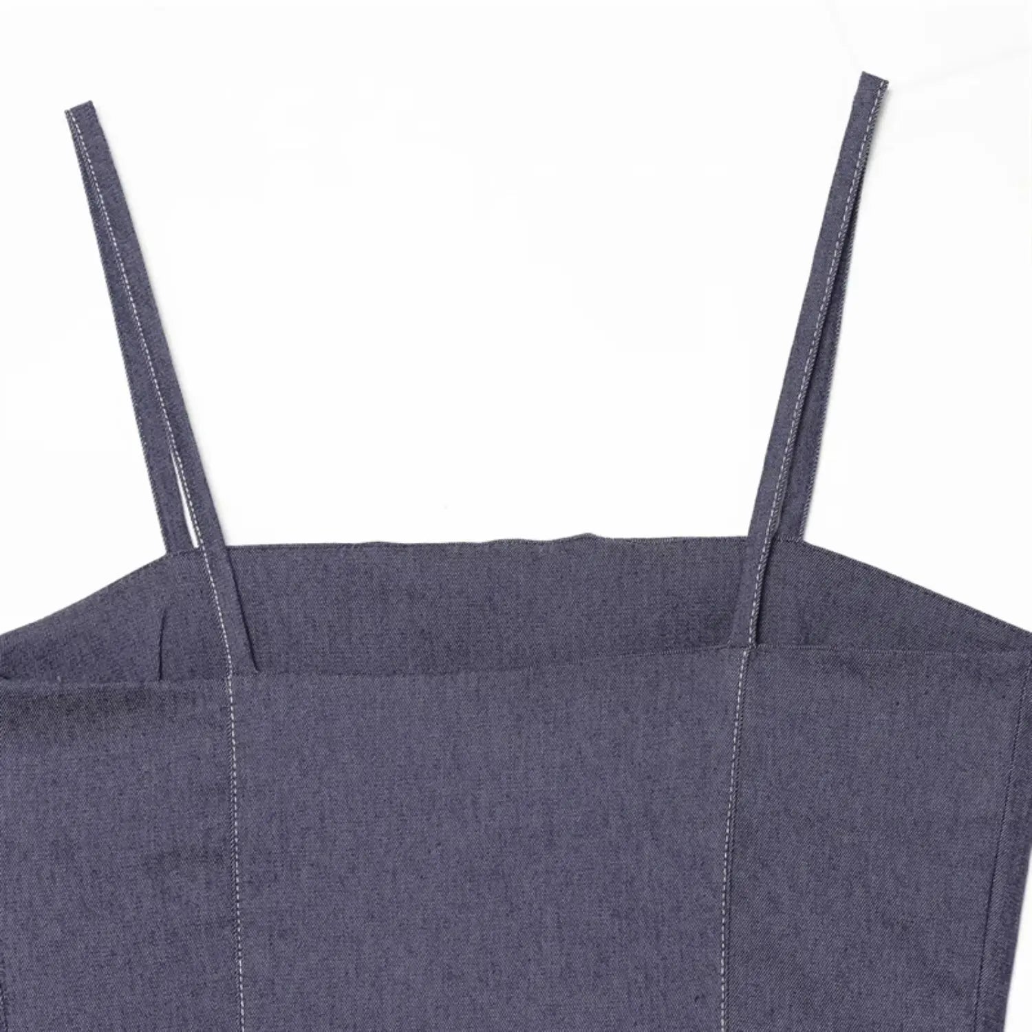Upper back & shoulder strap close-up, thin self-fabric spaghetti straps, square back neckline, twill denim texture with white contrast stitching