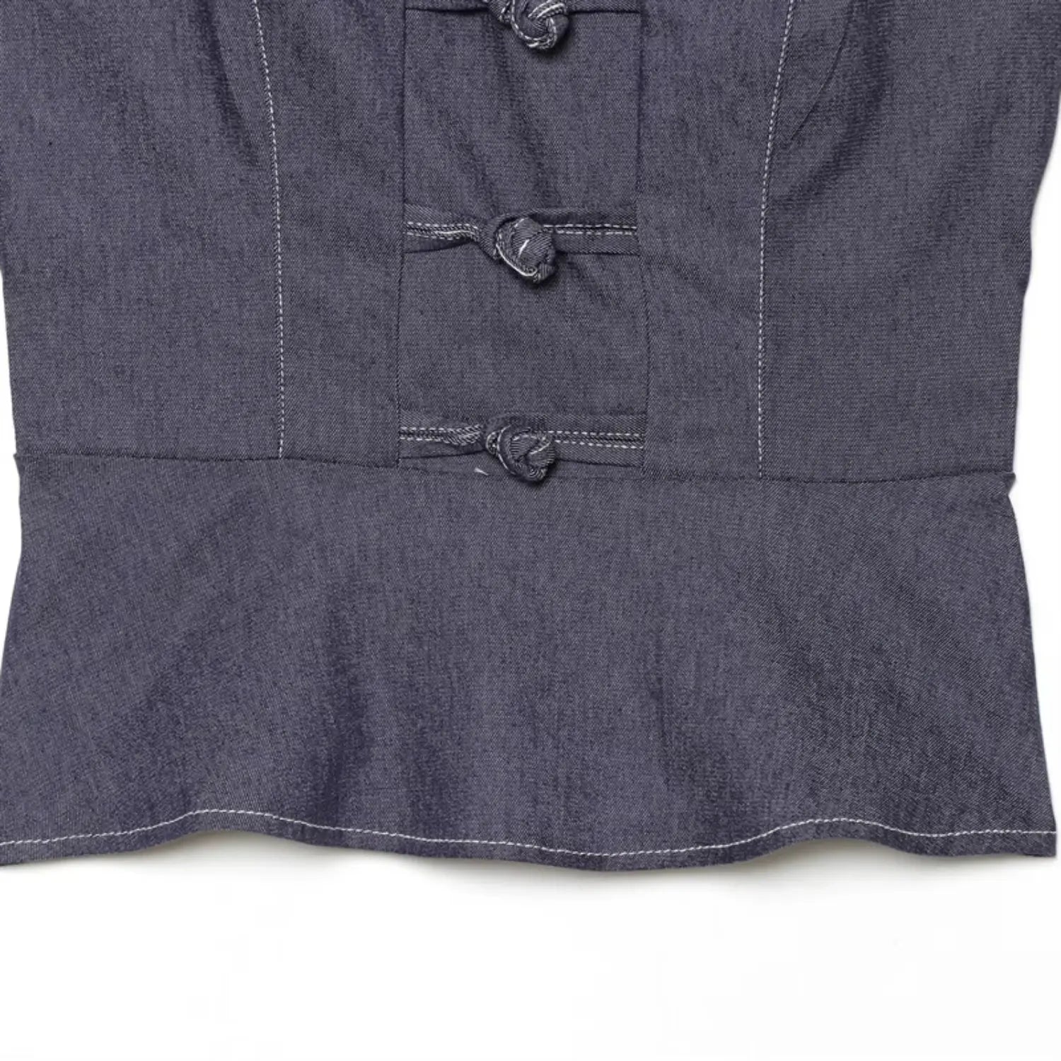 Waist to peplum hem transition close-up, horizontal waist seam, flared ruffle peplum bottom, uniform white hem topstitching