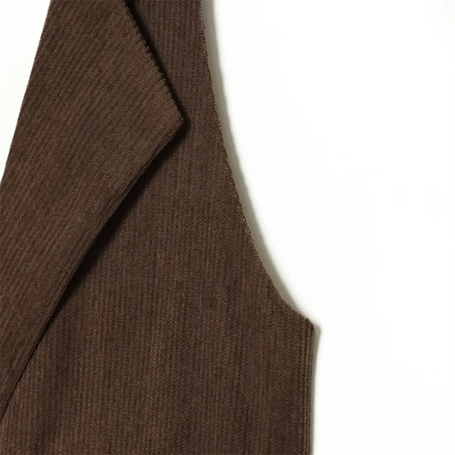 Corduroy fabric texture closeup dark brown sleeveless waistcoat