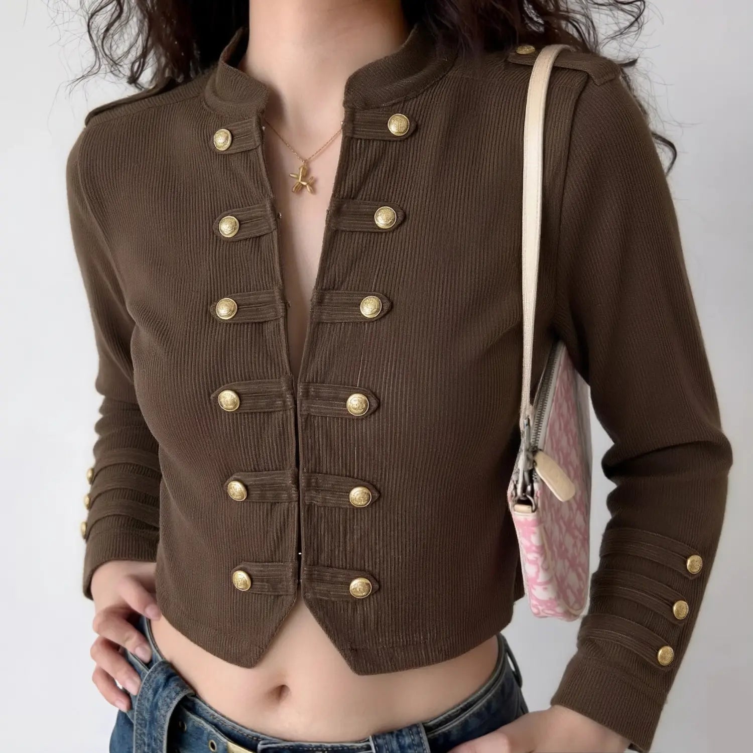 Woman wearing dark brown corduroy cropped military jacket casual vintage outfit