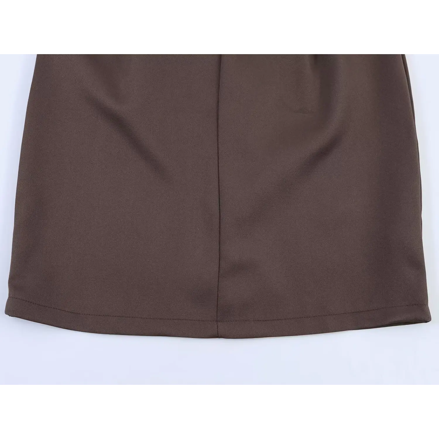 Lower skirt back flat shot, solid matte brown suiting fabric, central vertical shaping seam, straight finished mini skirt hem with uniform stitching