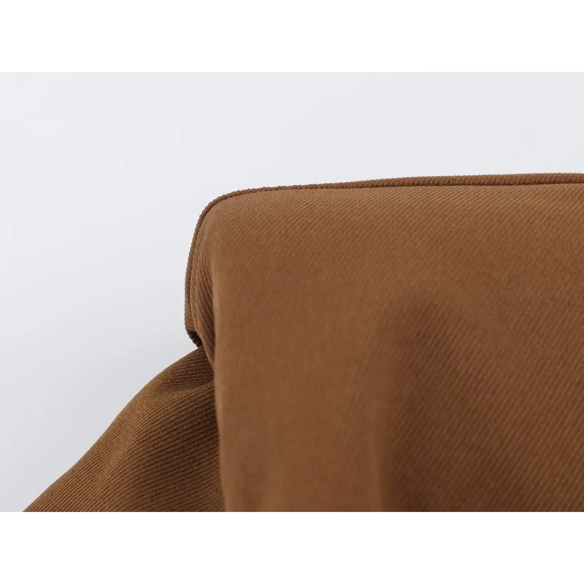Close-up of brown twill fabric showing texture and stitched edges