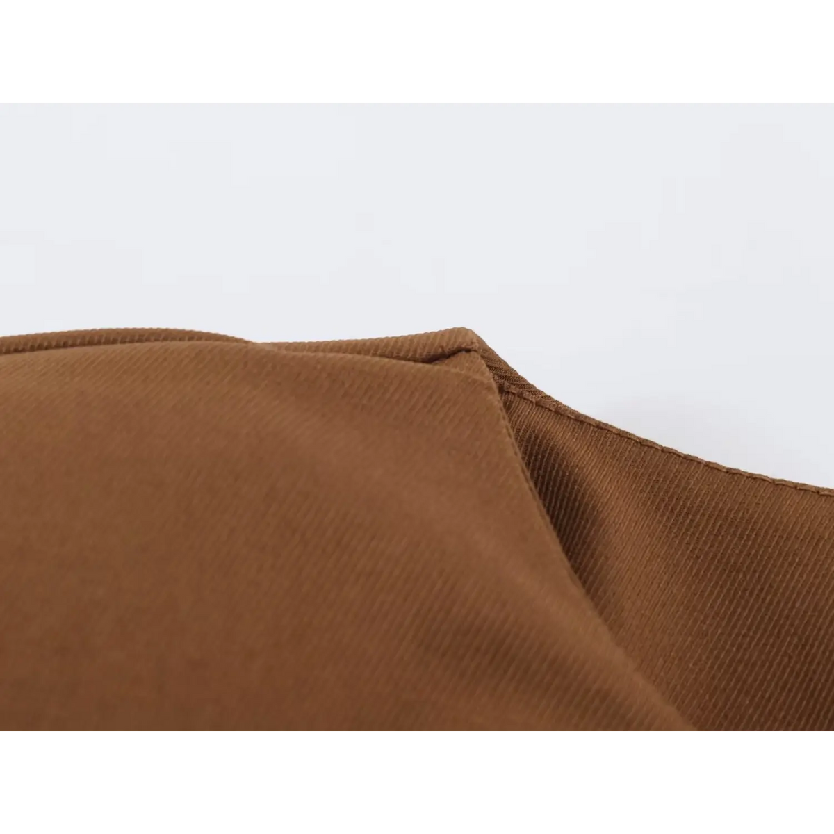 Close-up of twill fabric corner and neat seam stitching