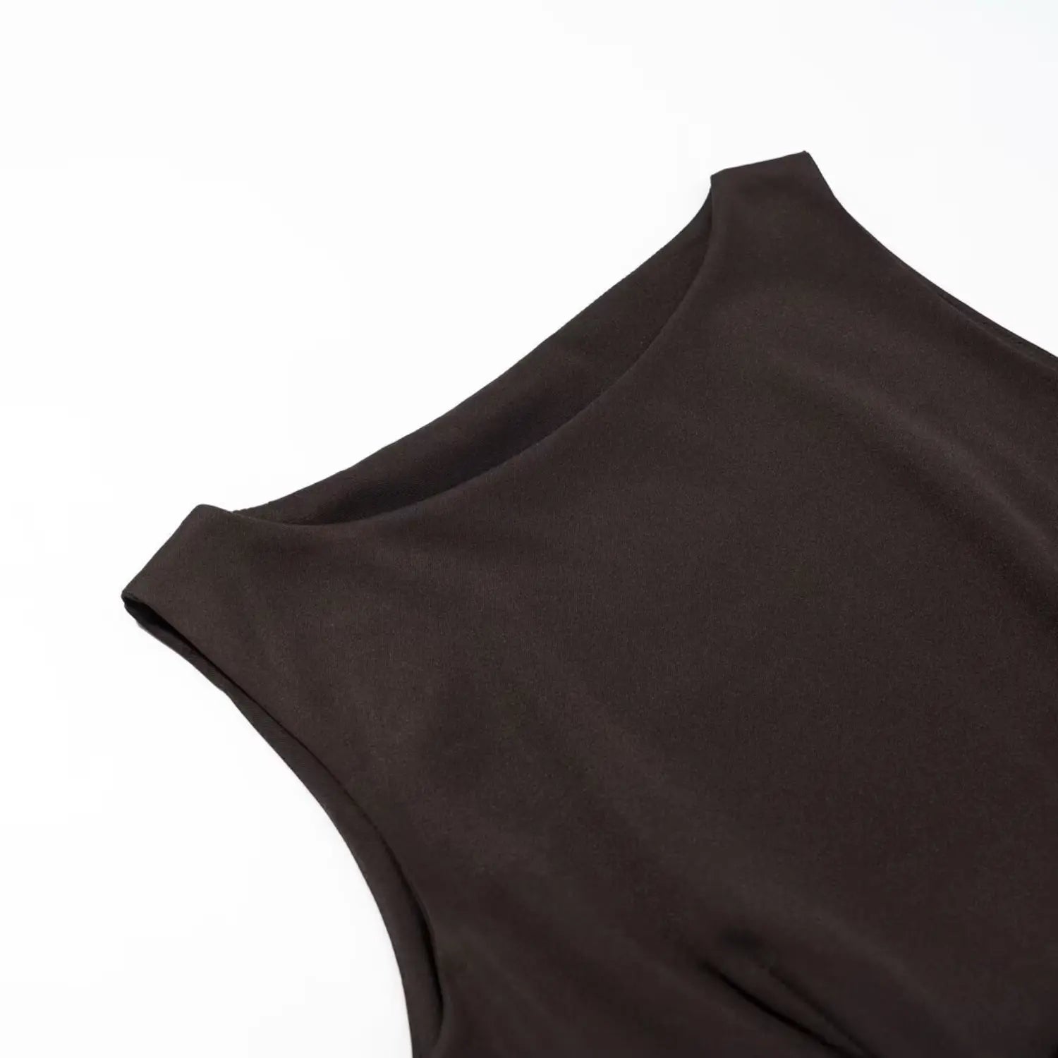Close‑up detail of round neckline and smooth fabric for dark brown sleeveless dress