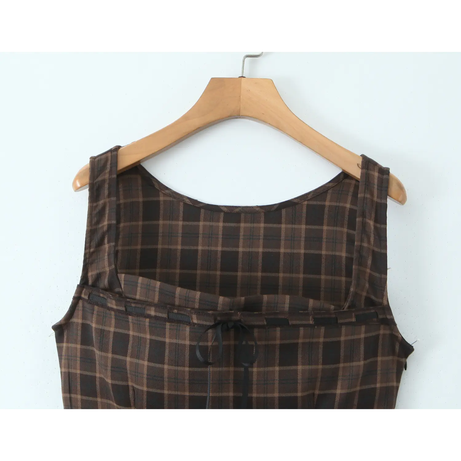 Full back neck flat view, wide matching plaid shoulder straps, scoop back, multi black ribbed ribbon yoke panel with central self-fabric bow tie
