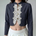 Female model wearing dark denim lace trim stand collar cropped jacket