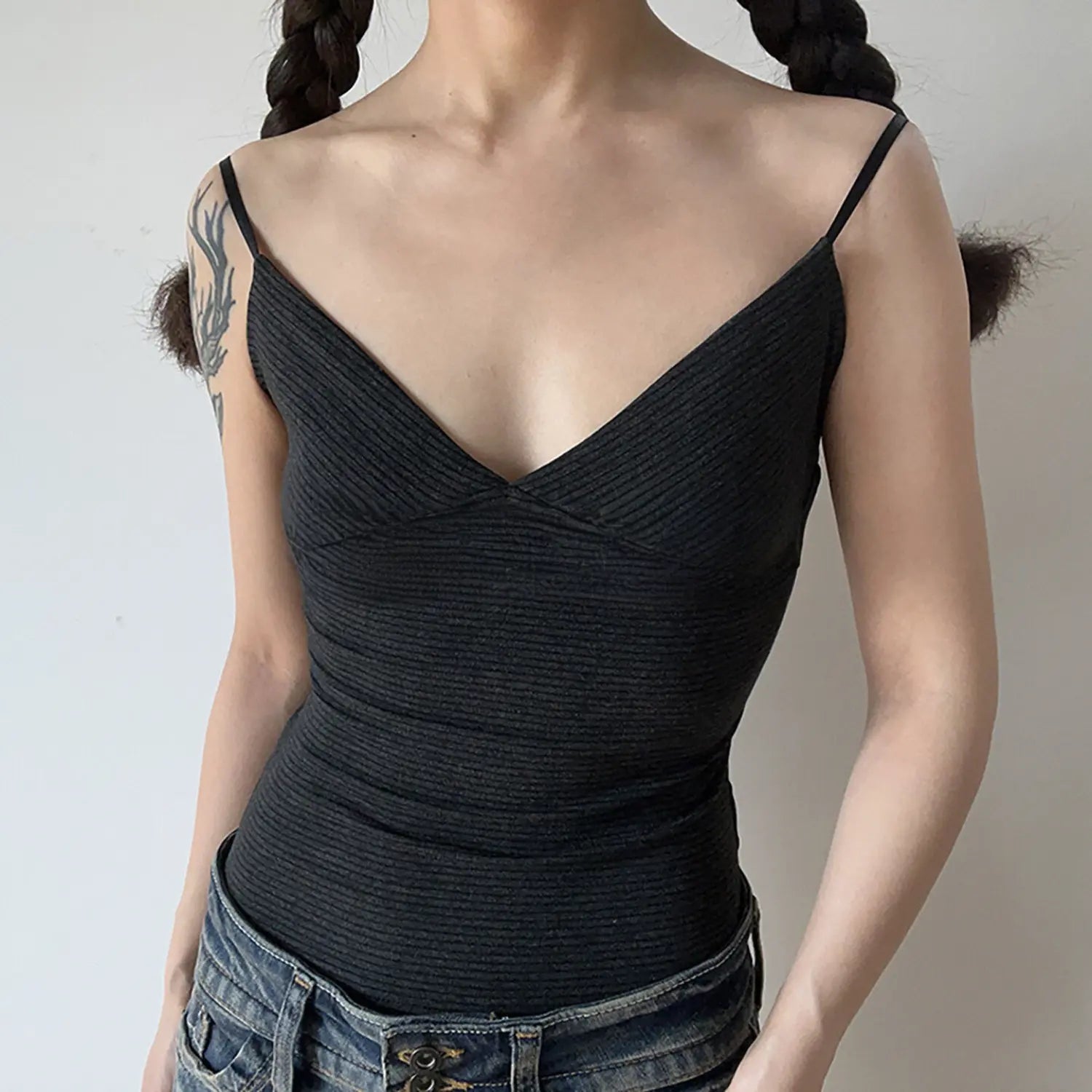 Close front view dark gray heavyweight ribbed cami tank top, deep wrap V neck slim bodycon silhouette thin spaghetti straps casual layering top