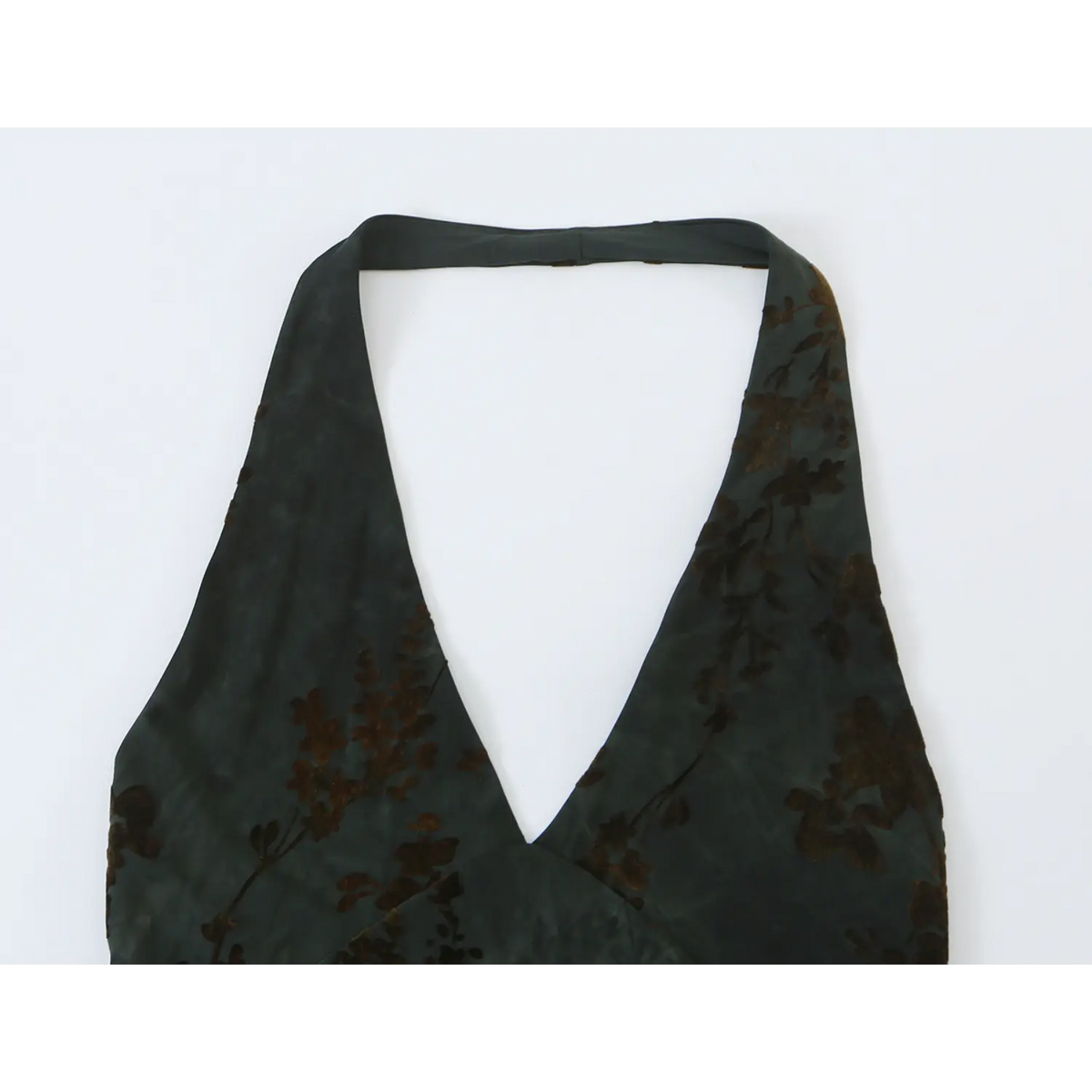 Close‑up of halter neckline and deep V front on dark green floral chiffon maxi dress