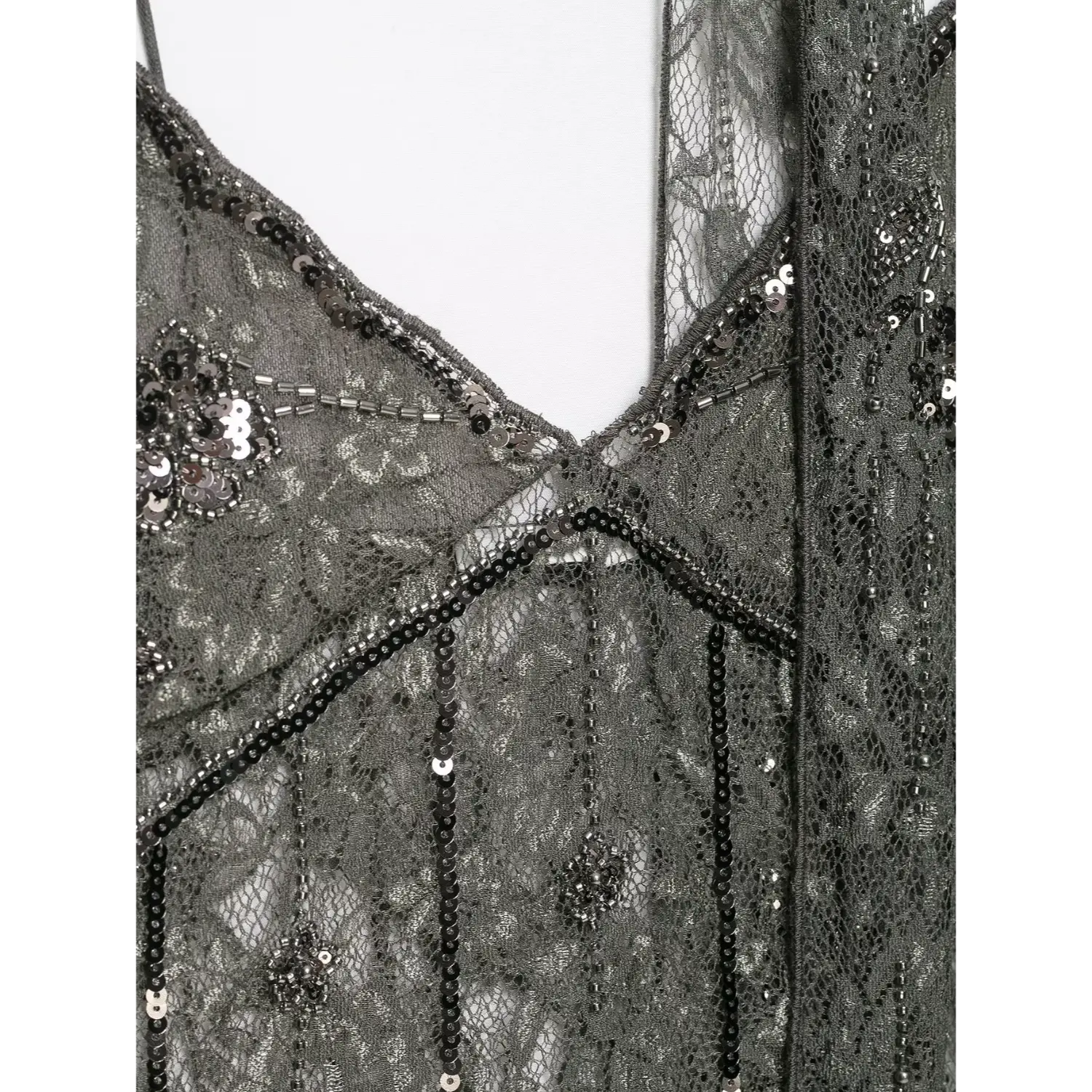Extreme close‑up v‑neckline trim with tube bead and sequin stitching on dark grey sheer lace camisole