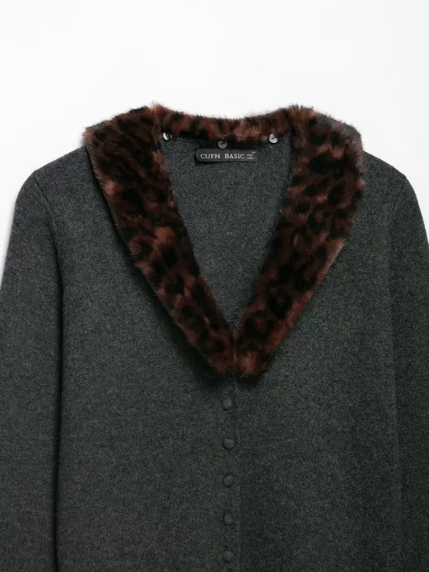 Close-up of V neck fur collar and button placket